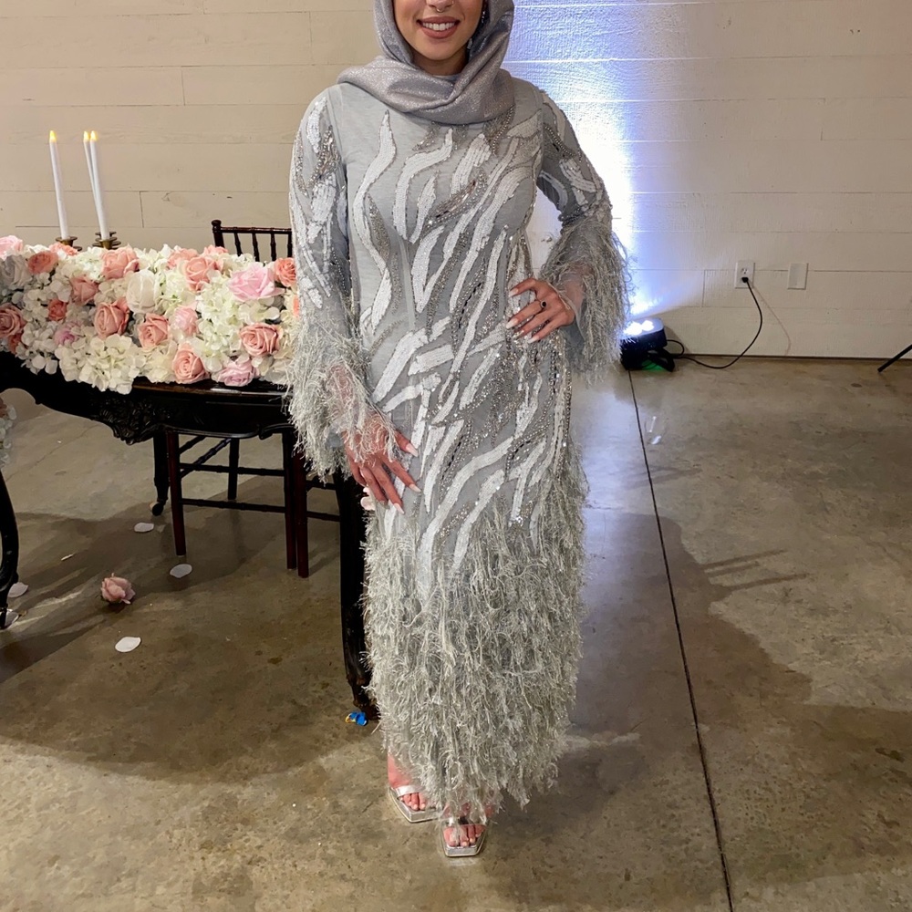 Beaded dress with feathers